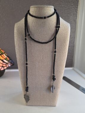 Black Beaded Lariat Necklace with Leaf Charms